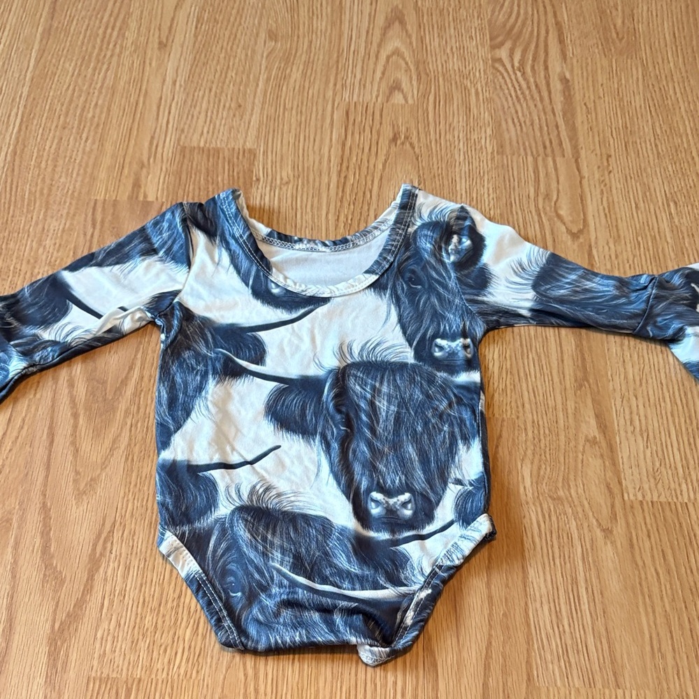Kids Long Sleeve One-Piece Bodysuit in Navy Cow Print